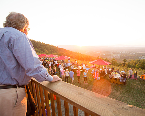 View of Carter Mountain Orchard from the back deck during a live music sunset event