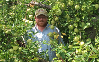 Farmer Henry amongst the apples