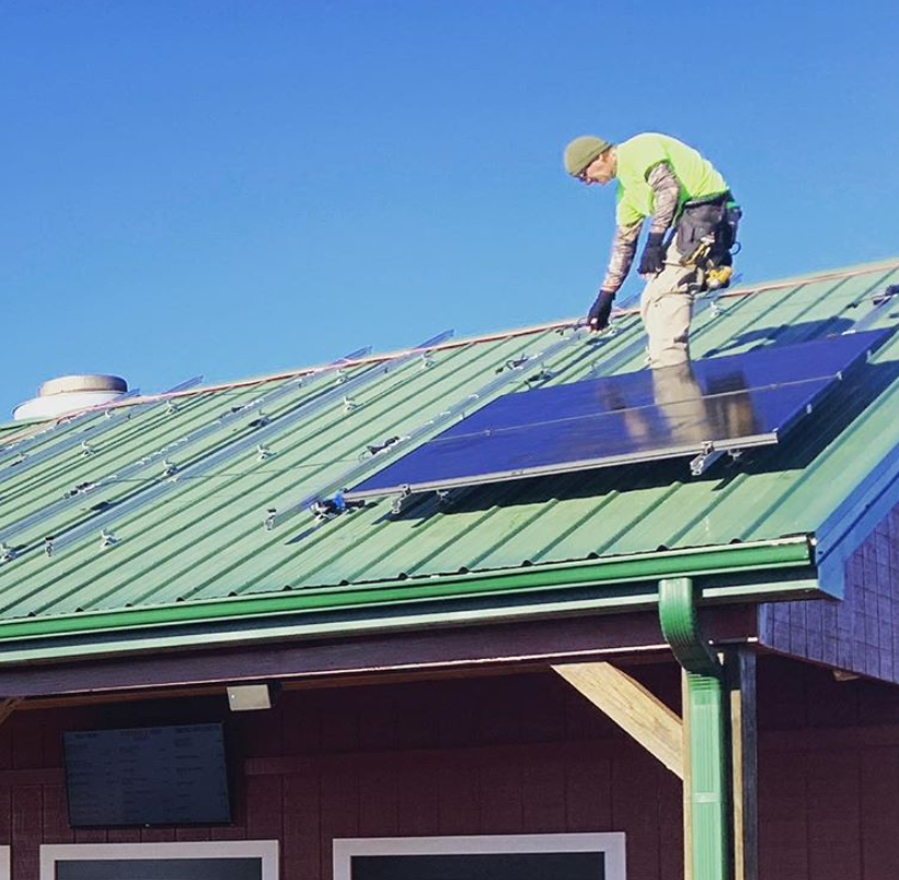 Solar panels being installed at Carter Mountain Orchard's Apple Barn