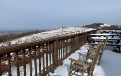Snow covering the deck and rocking chairs at Carter Mountain Orchard