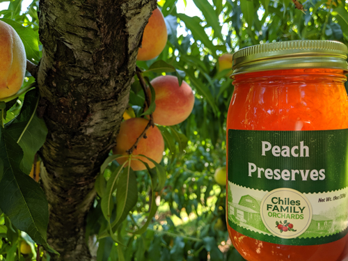 Glass Jar of Peach Preserves by Chiles Family Orchards