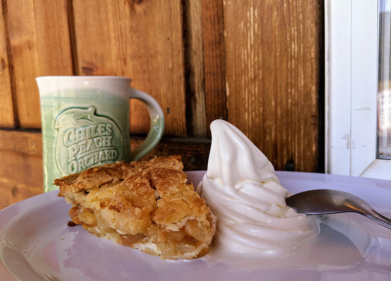 Slice of apple pie and soft-serve ice cream at Chiles Peach Orchard